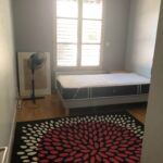 Bright private student bedroom with bed and natural light in a Lyon host family