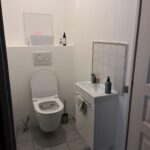 Separate toilet with washbasin in a Lyon host family home