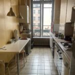 Bright and fully equipped kitchen with large window in a host family apartment in Lyon city centre.