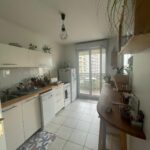 Welcoming open-plan kitchen and living area in a Lyon host family home for international students.